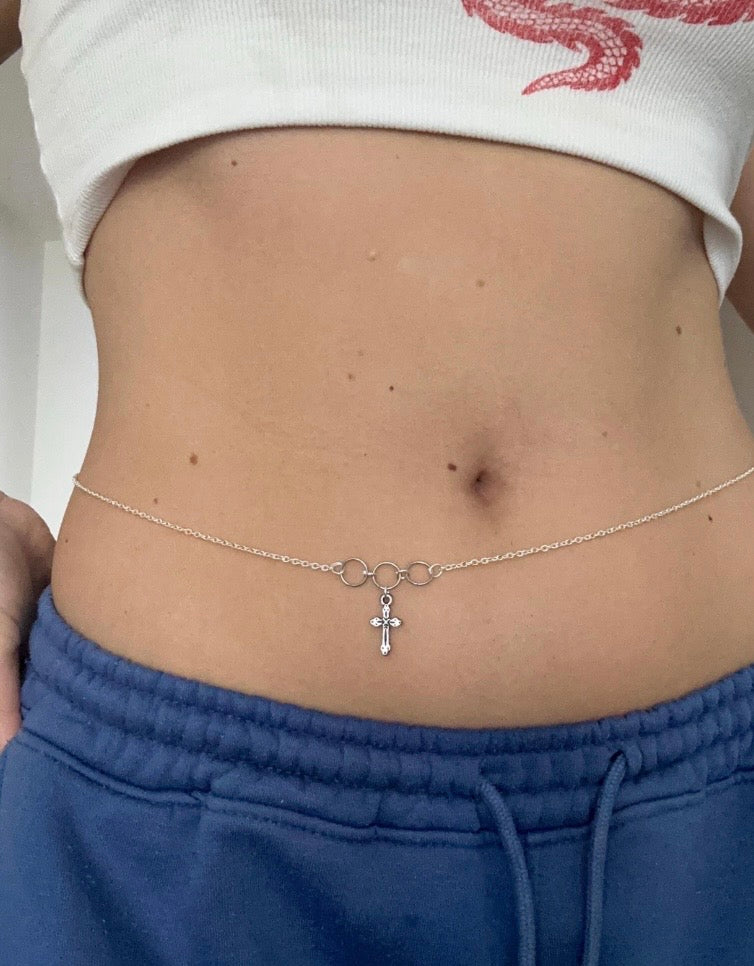 Icegold by Vee cross pendant belly chain featuring a delicate chain with a small cross pendant, designed for stylish body jewelry.