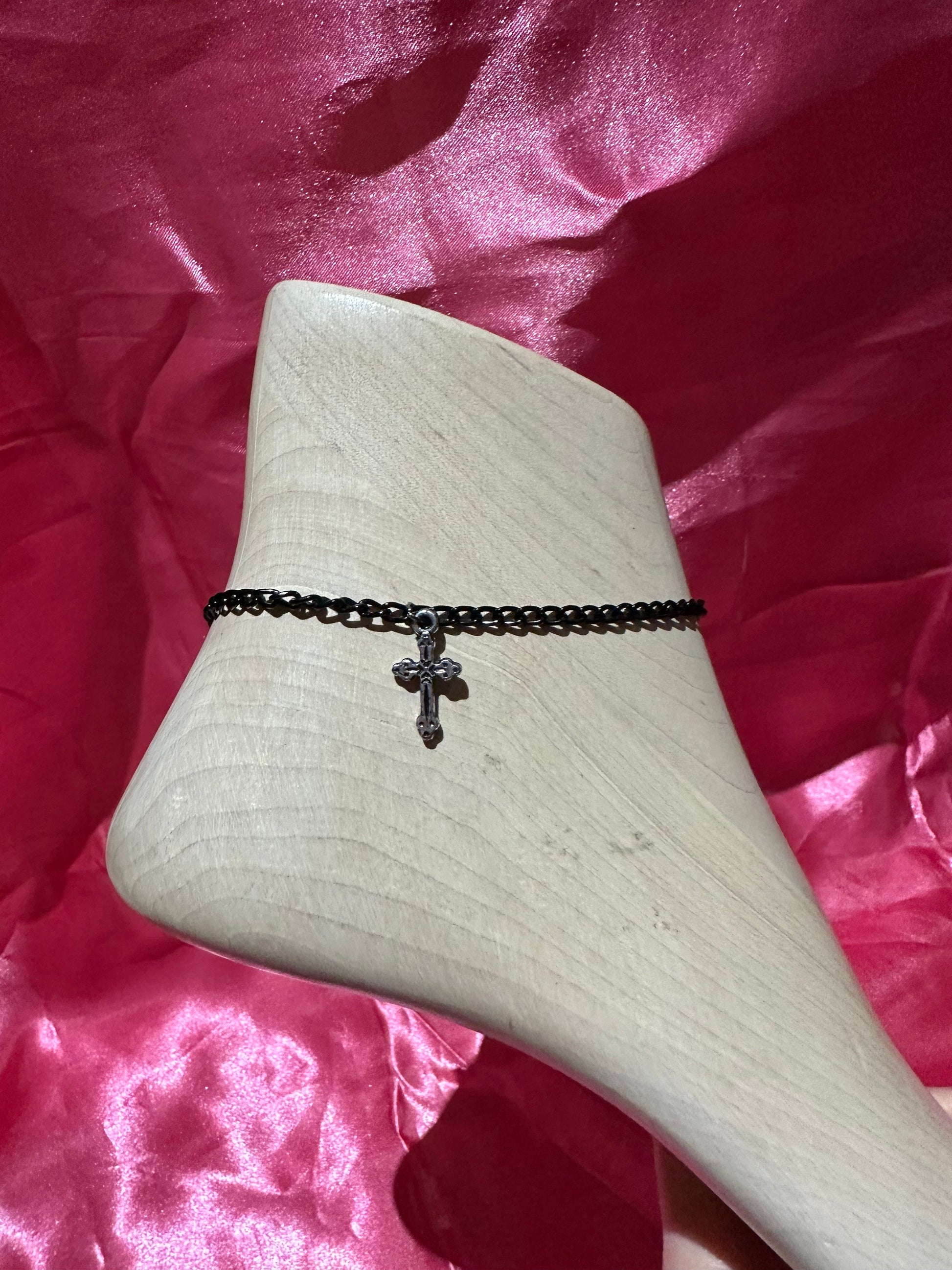 Silver cross anklet by Icegoldbyvee featuring delicate chain and cross charm, designed for ankle adornment.
