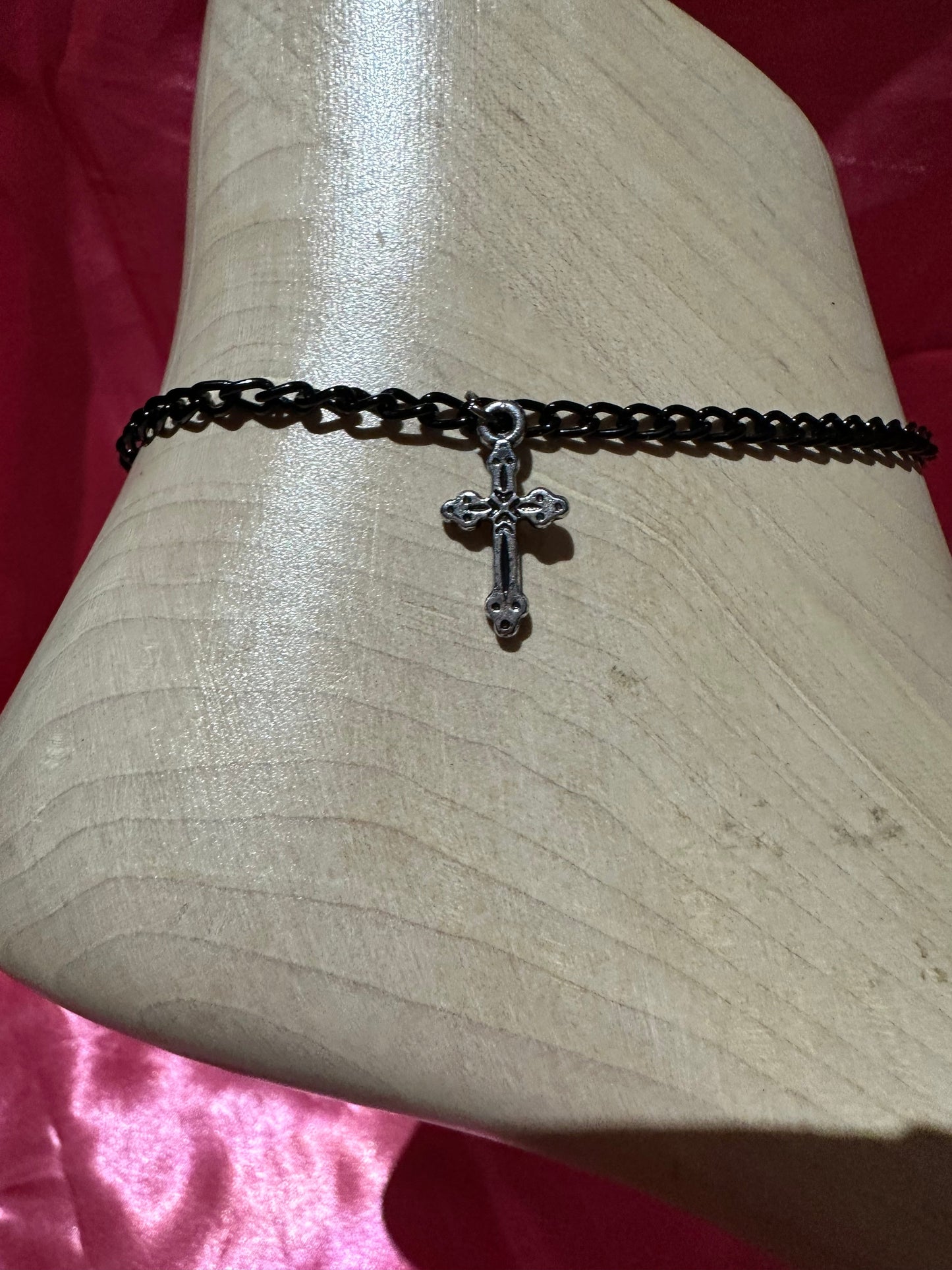 Icegoldbyvee cross anklet featuring delicate chain with small cross charm, worn around the ankle.