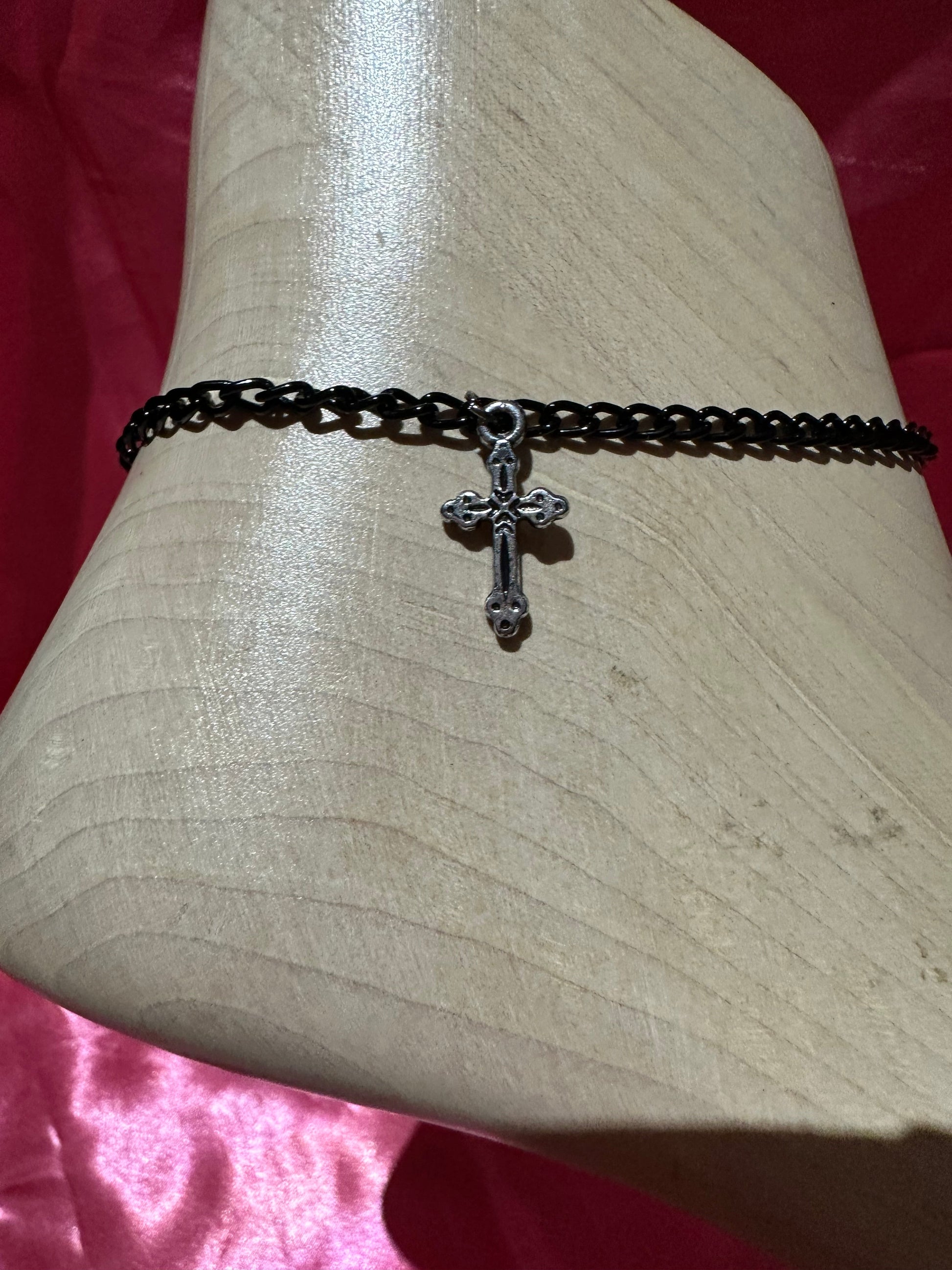 Icegoldbyvee cross anklet featuring delicate chain with small cross charm, worn around the ankle.