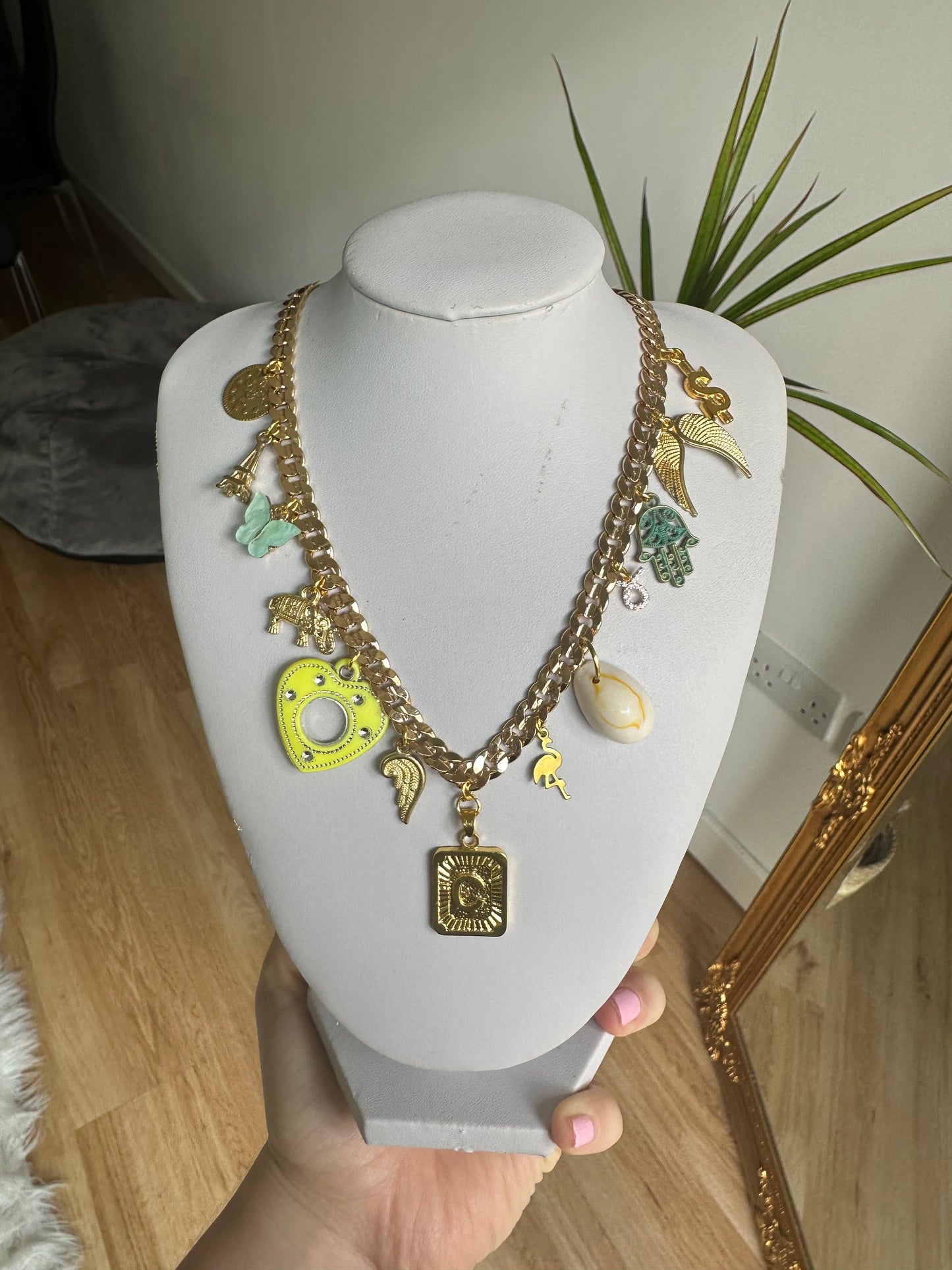 Gold multi charm letter necklace